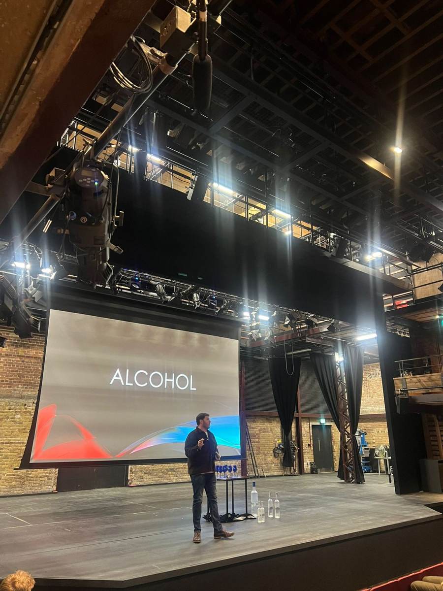 The alcohol session being delivered on a theatre stage